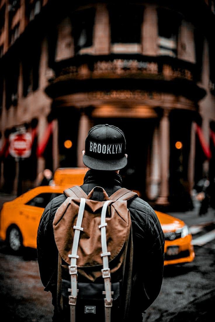 Creating Adam blog post title image. Man standing in front of traffic in the city.