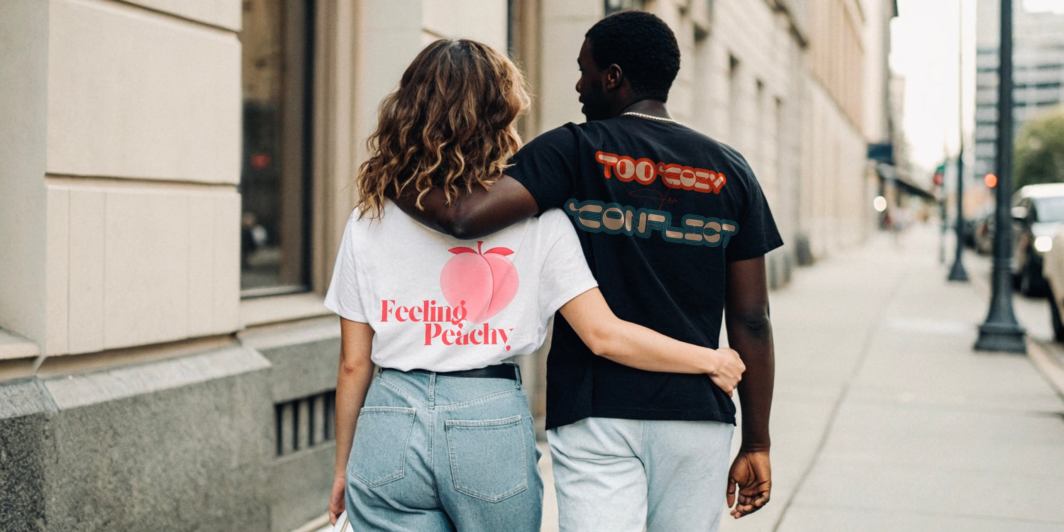 Creating Adam's the peach tee worn by a female model in arms with a male model wearing the chill tee black